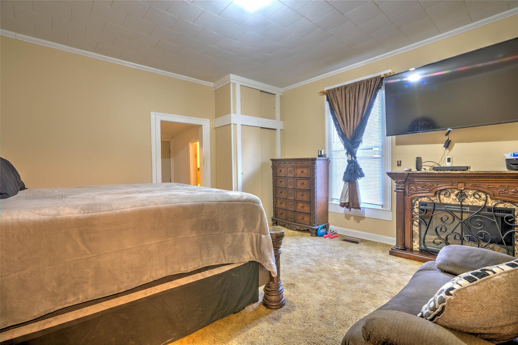 54 Bunker Street Rockingham, NC 28379 - Photo 17 of 22 a bedroom with a bed and a flat screen tv