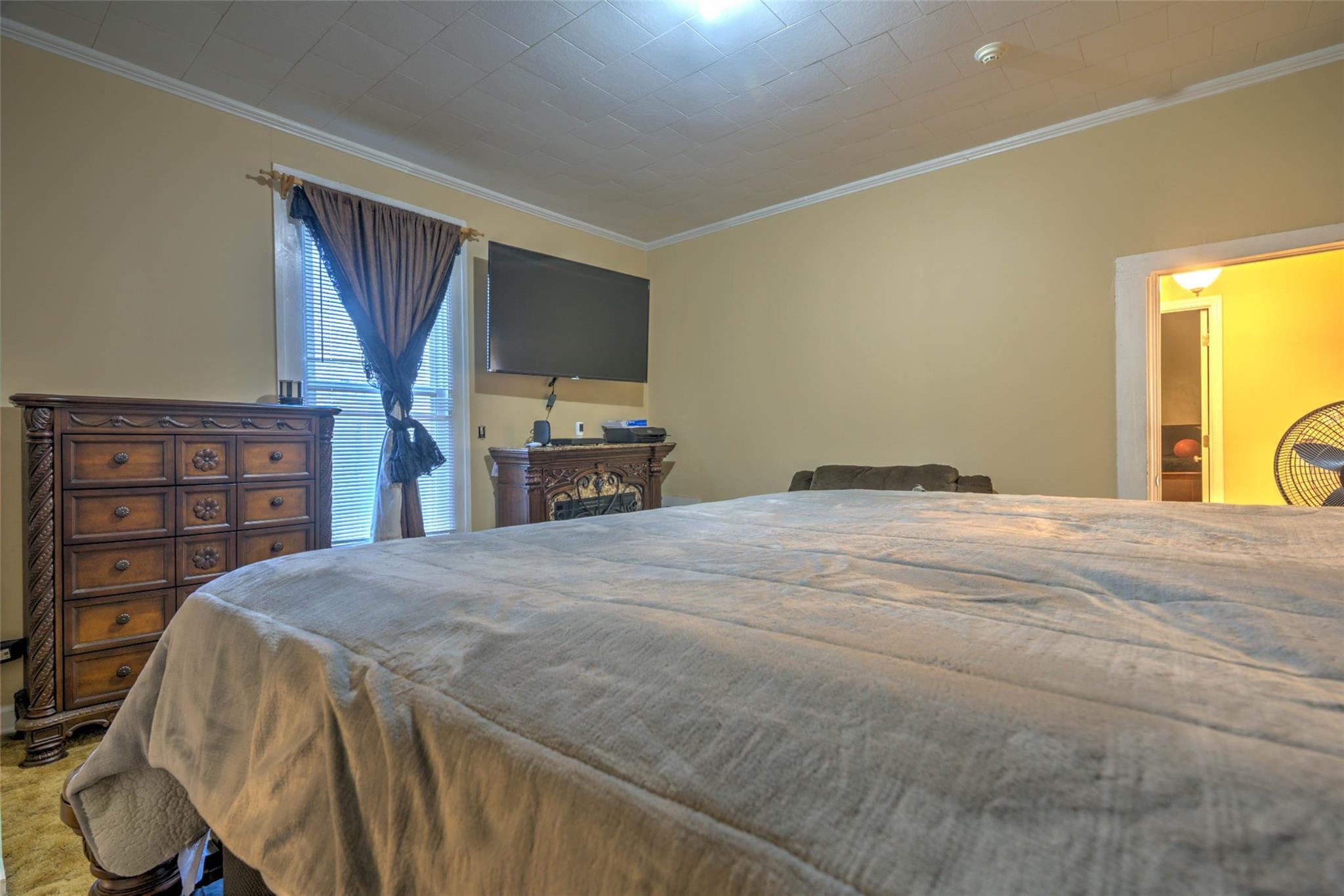 54 Bunker Street Rockingham, NC 28379 - Photo 18 of 22 a bedroom with a bed and a flat screen tv