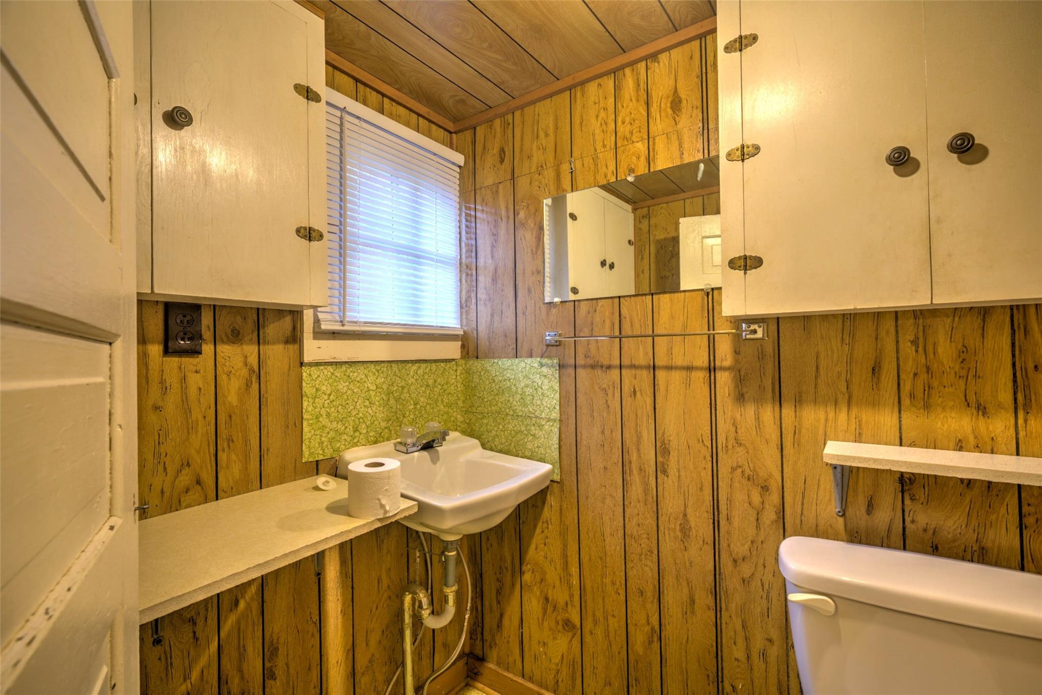 54 Bunker Street Rockingham, NC 28379 - Photo 19 of 22 a bathroom with a sink toilet and shower