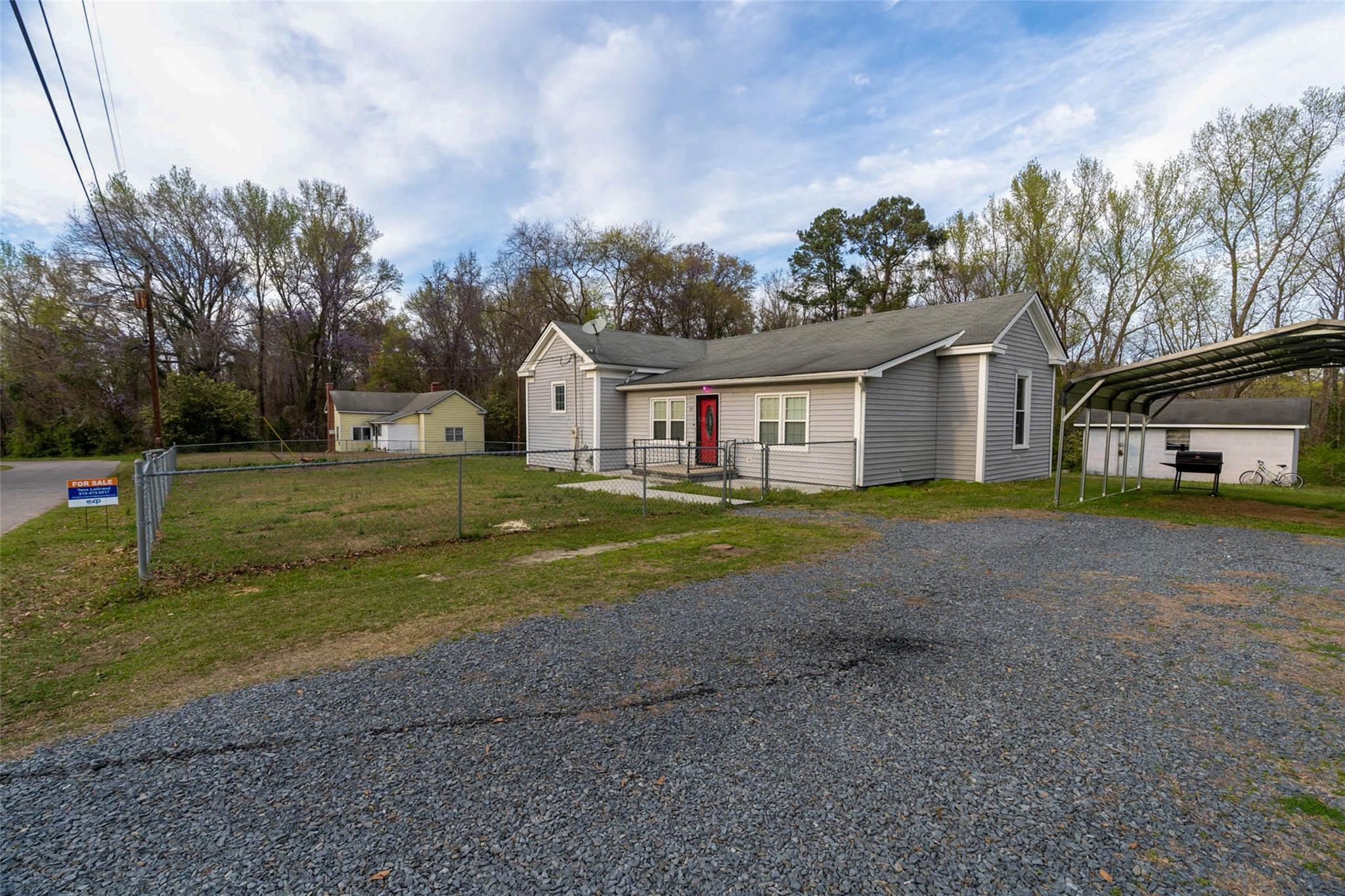 54 Bunker Street Rockingham, NC 28379 - Photo 4 of 22 a view of a house with a big yard and large trees