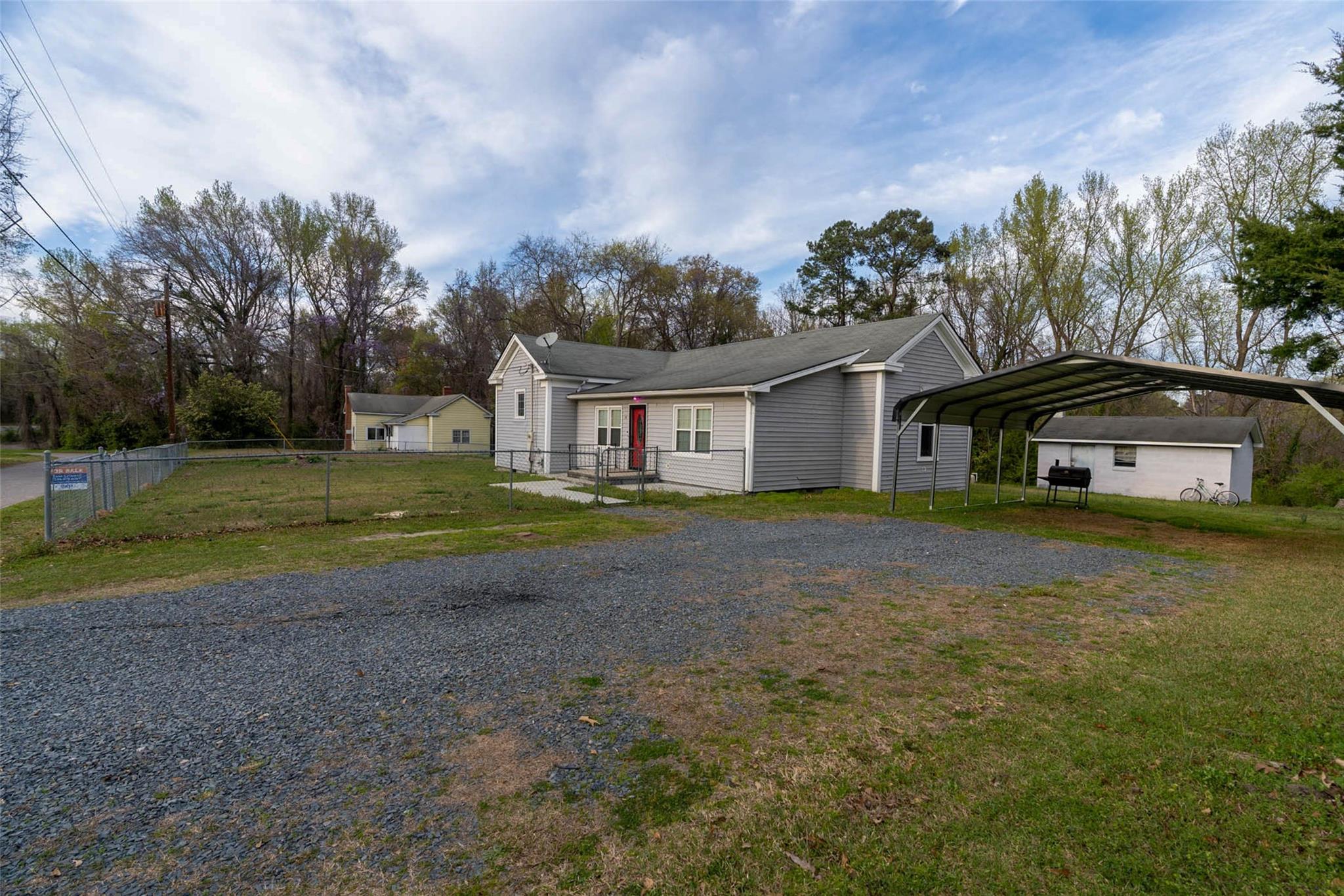 54 Bunker Street Rockingham, NC 28379 - Photo 5 of 22 a house view with a garden space