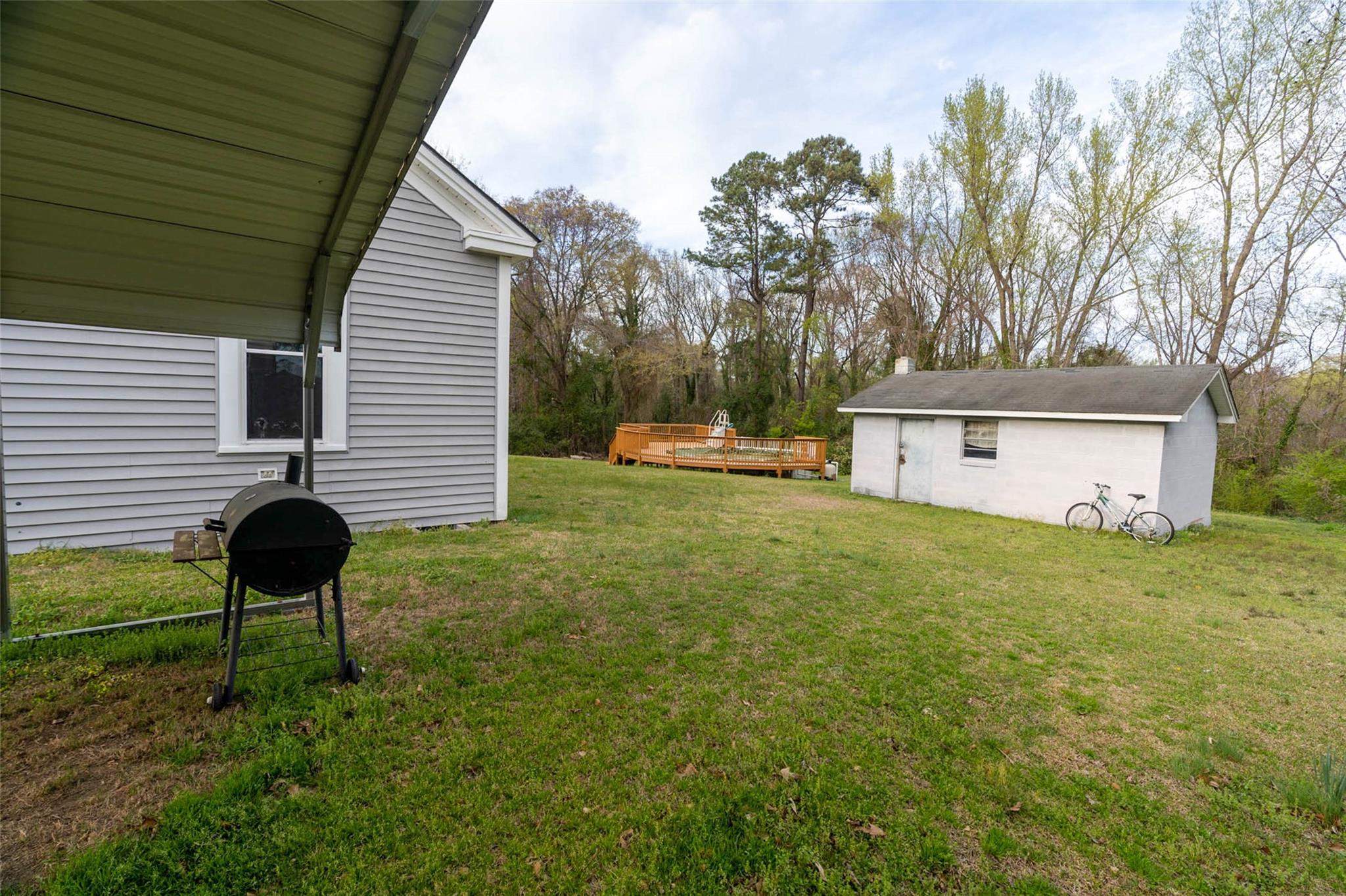 54 Bunker Street Rockingham, NC 28379 - Photo 6 of 22 a backyard of a house with table and chairs