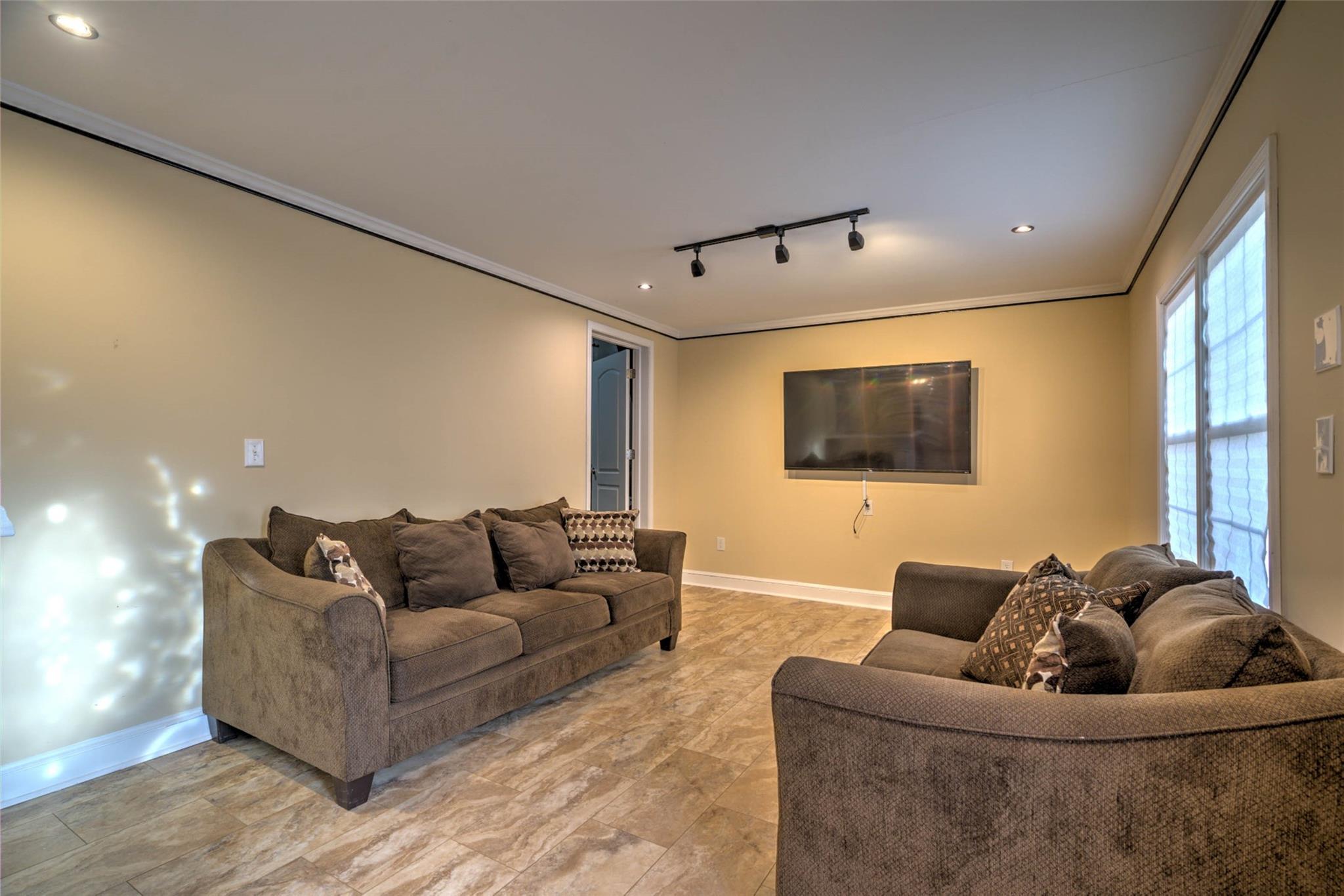 54 Bunker Street Rockingham, NC 28379 - Photo 10 of 22 a living room with furniture and a flat screen tv