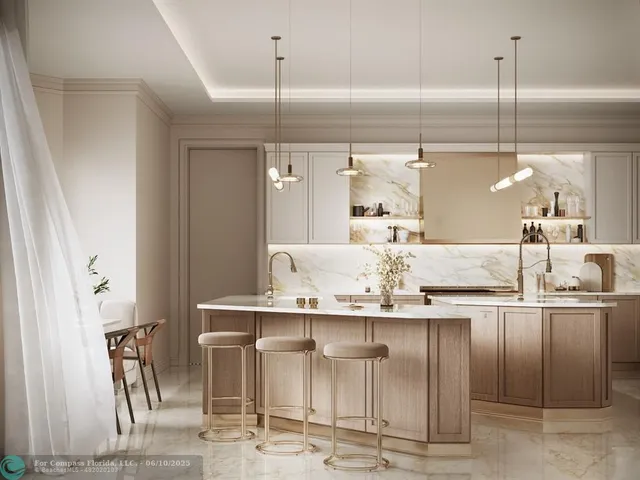 a kitchen with kitchen island granite countertop a view of counter top space cabinets and appliances