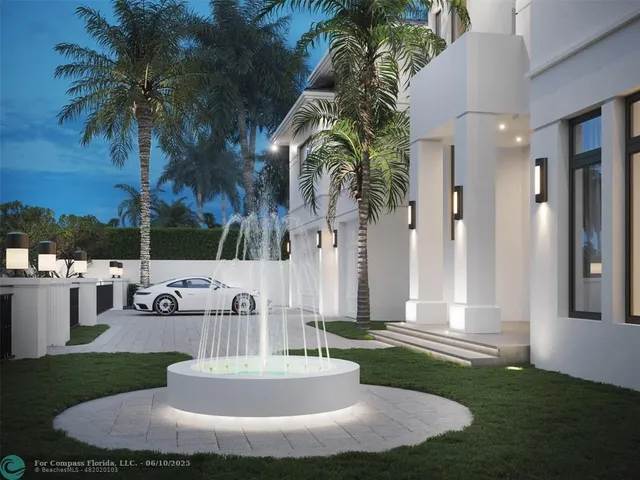 a view of a house with a yard and palm trees