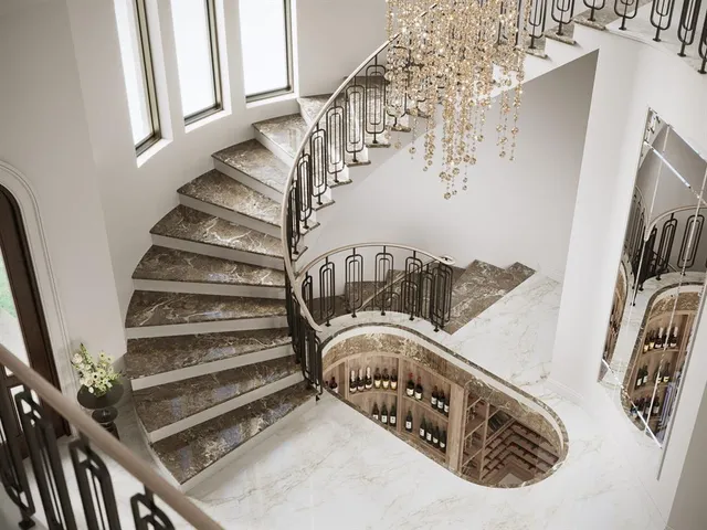 a view of staircase with lots of frames on wall and a window