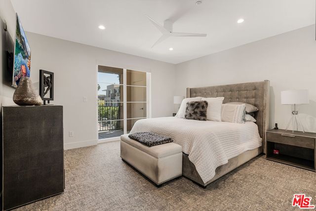 a bathroom with a double vanity sink a mirror a bathtub and shower