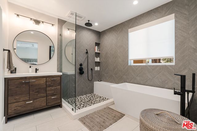 a bathroom with a bathtub and shower