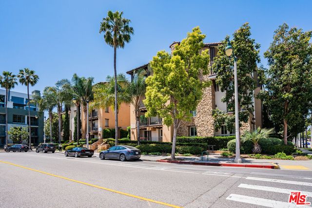 a view of building with an outdoor space and lakeside