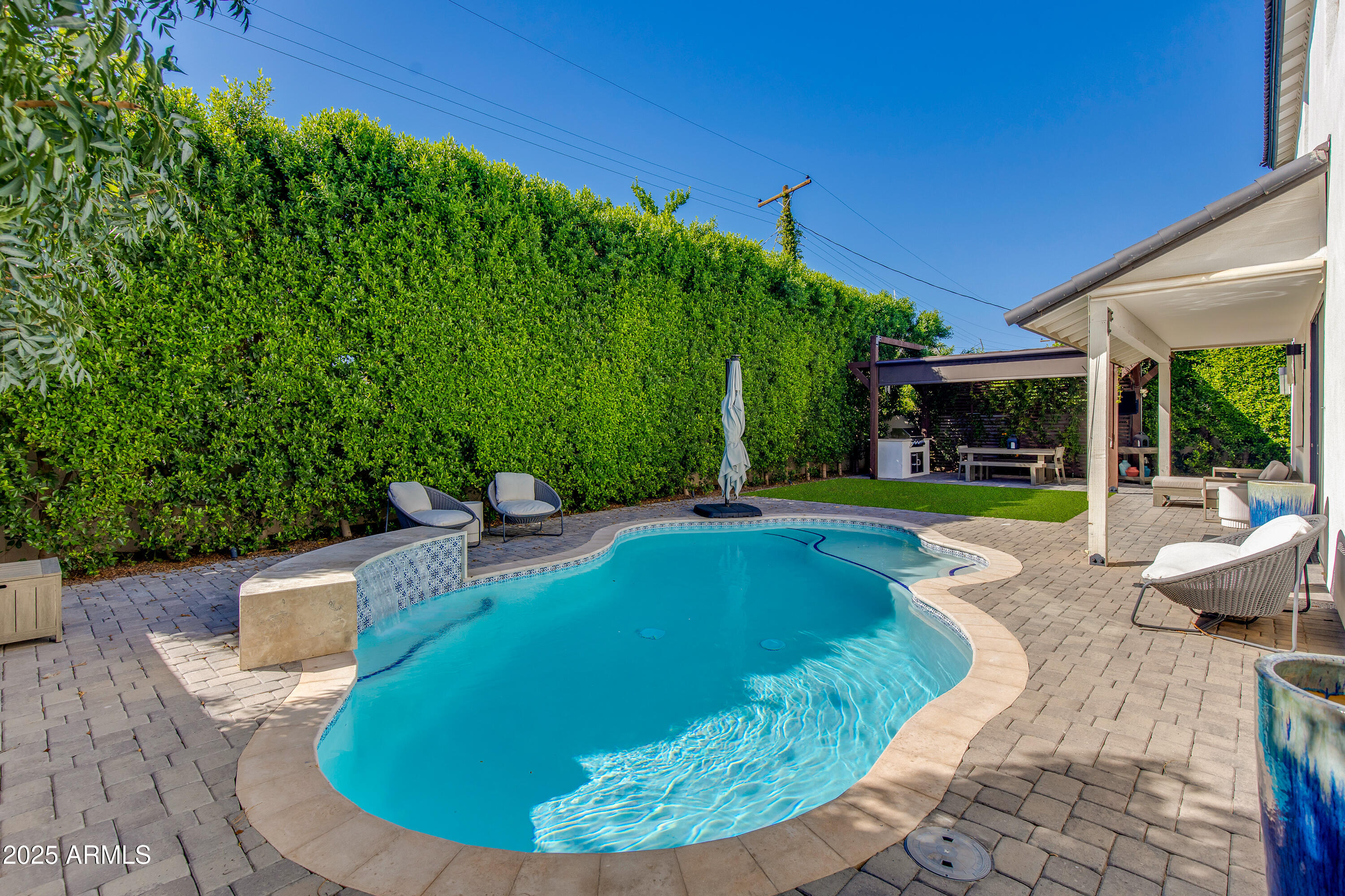 3821 East Devonshire Avenue Phoenix, AZ 85018 - Photo 15 of 20 a view of a swimming pool with a patio