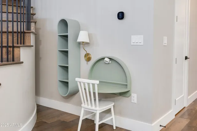 a view of staircase with white walls and window