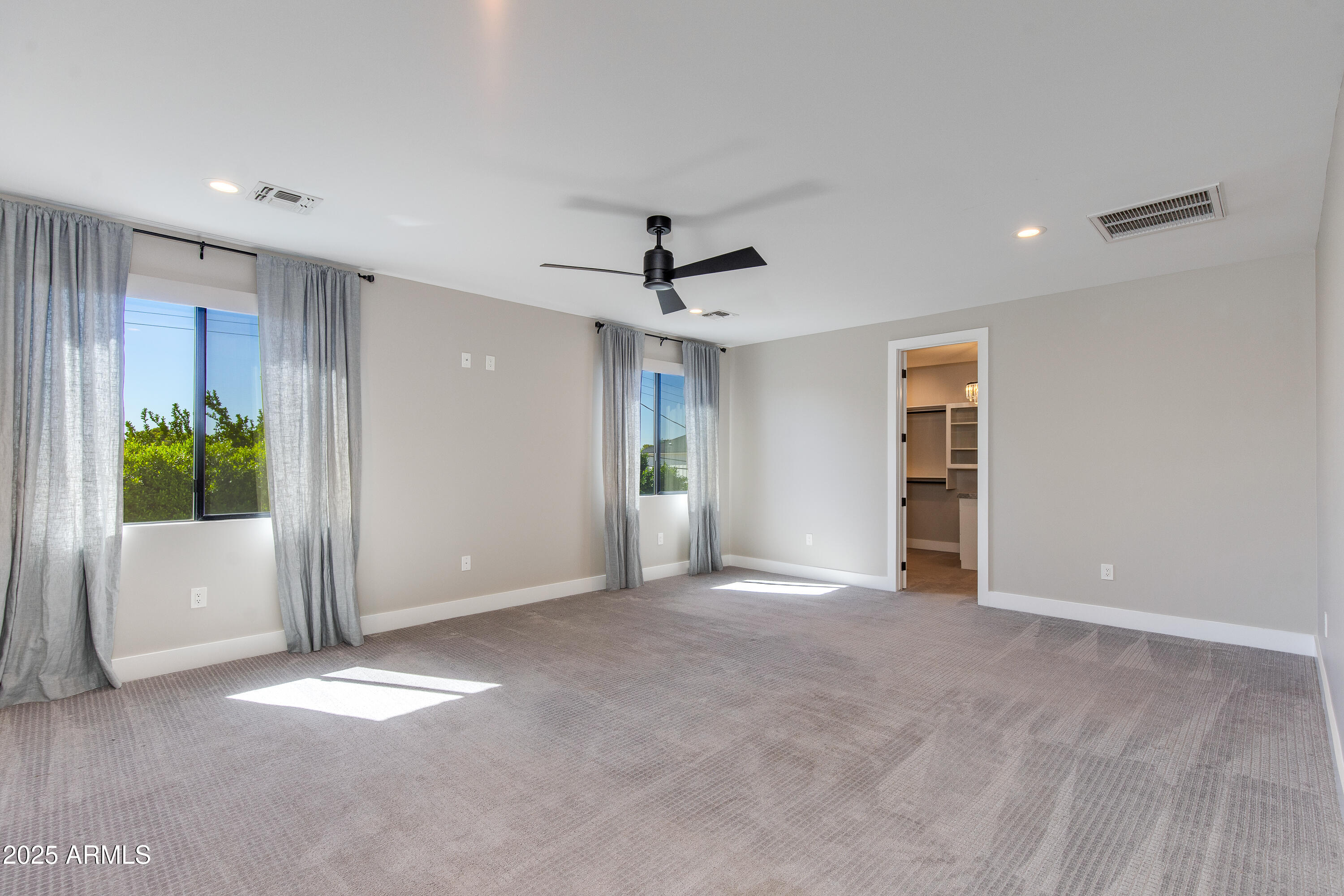 3821 East Devonshire Avenue Phoenix, AZ 85018 - Photo 8 of 20 an empty room with windows and closet
