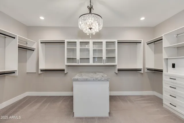a kitchen with stainless steel appliances granite countertop a cabinets and a large window
