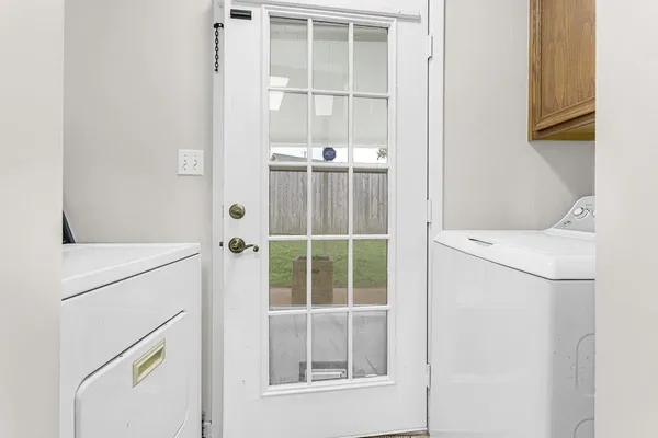 a utility room with dryer and washer