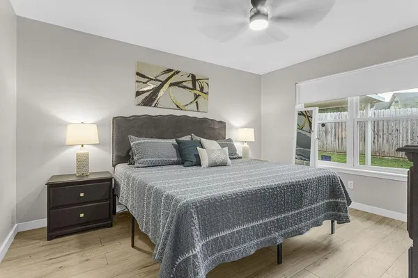 a bedroom with a bed and window
