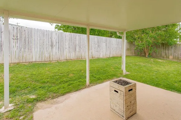 a view of a backyard with a garden and plants