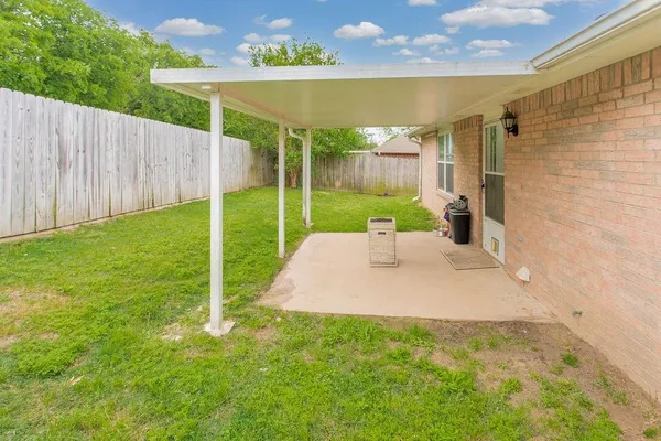 a view of a backyard with a garden