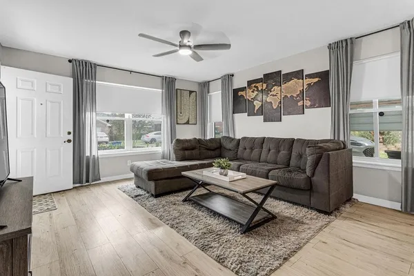 a living room with furniture and a large window