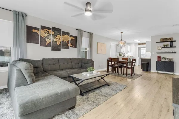 a living room with furniture and a fireplace