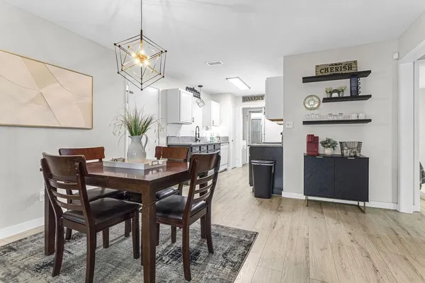 a view of a dining room with furniture and wooden floor