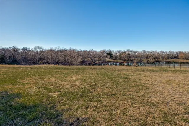 a view of a lake from a yard