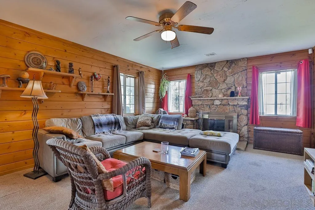 2260 Glenview Lane Vista, CA 92084 - Photo 20 of 24 a living room with furniture a fireplace and a large window