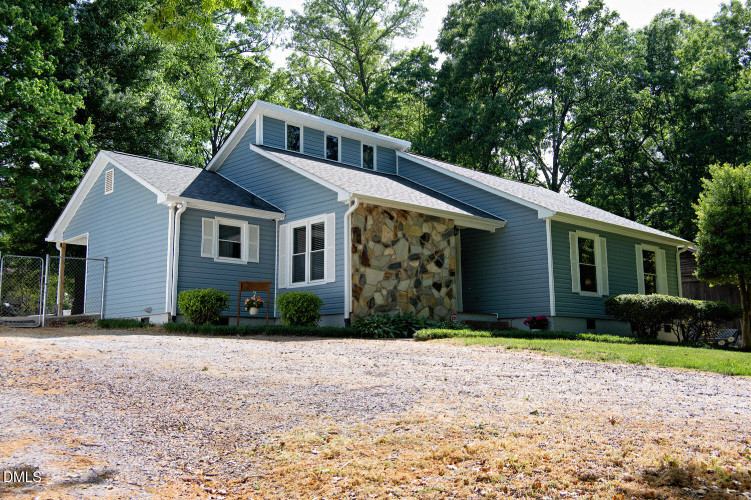 134 Longview Road Madison, NC 27025 - Photo 2 of 49 a front view of a house with a yard and garage