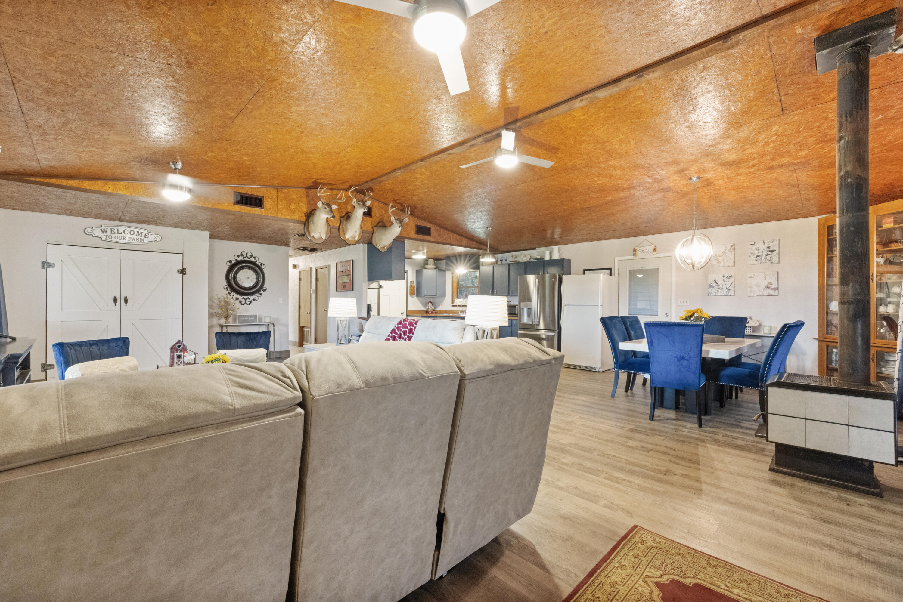 190 Peaden Bridge Road Baker, FL 32531 - Photo 12 of 73 a living room with furniture a dining table and chairs with wooden floor