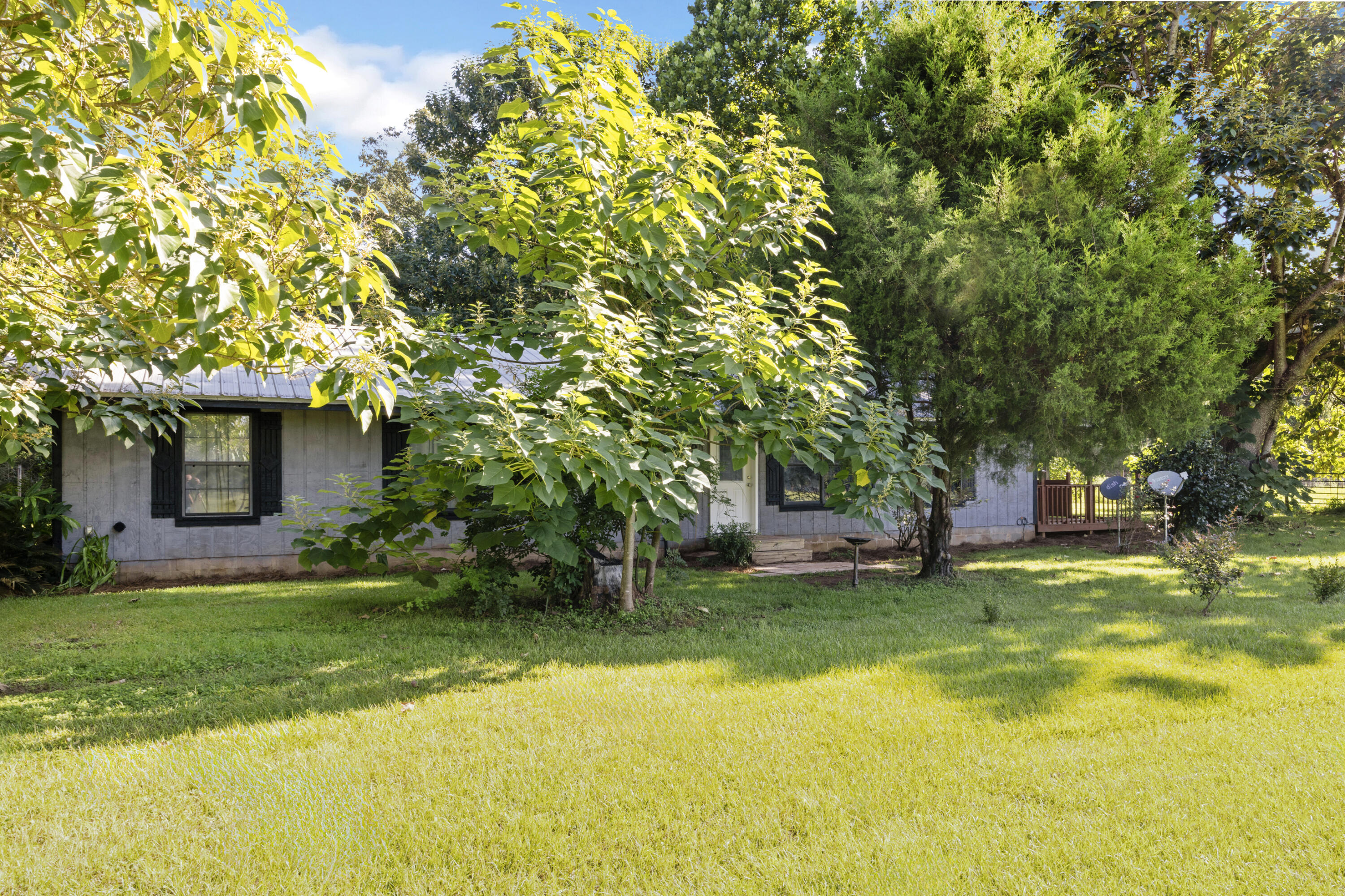 190 Peaden Bridge Road Baker, FL 32531 - Photo 2 of 73 a view of a backyard with a garden