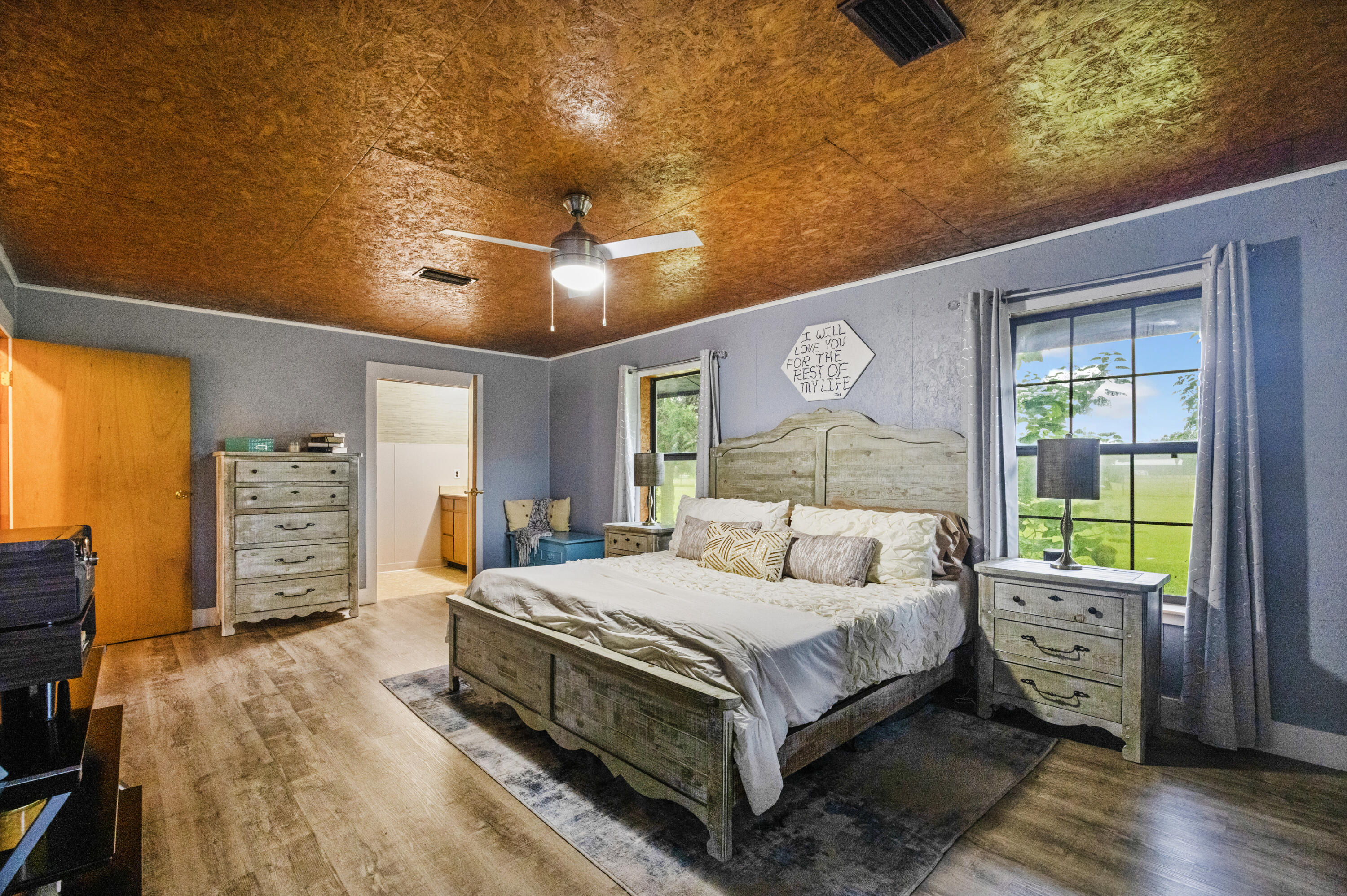 190 Peaden Bridge Road Baker, FL 32531 - Photo 28 of 73 a bedroom with a bed and wooden floor