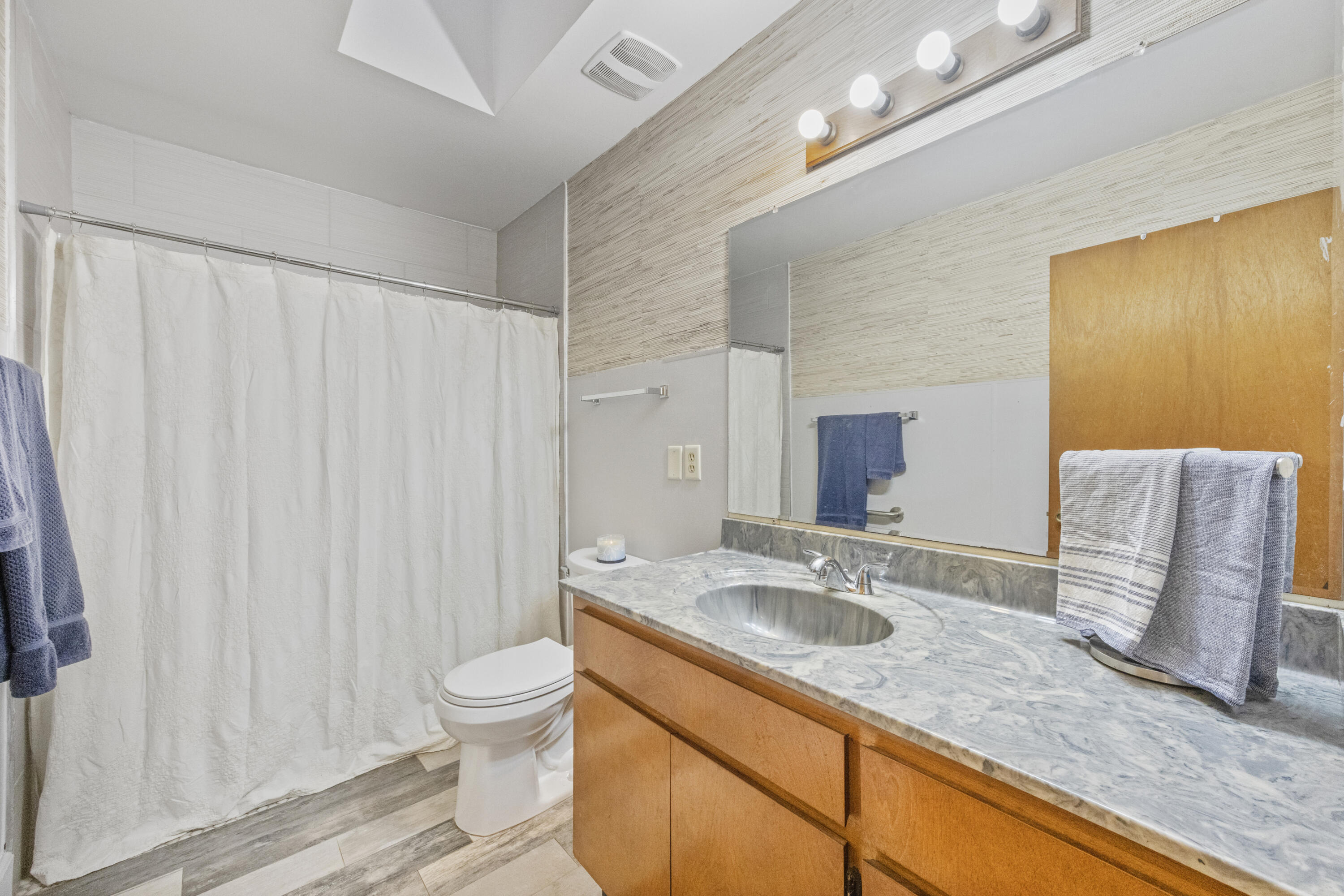 190 Peaden Bridge Road Baker, FL 32531 - Photo 34 of 73 a bathroom with a granite countertop sink and a mirror