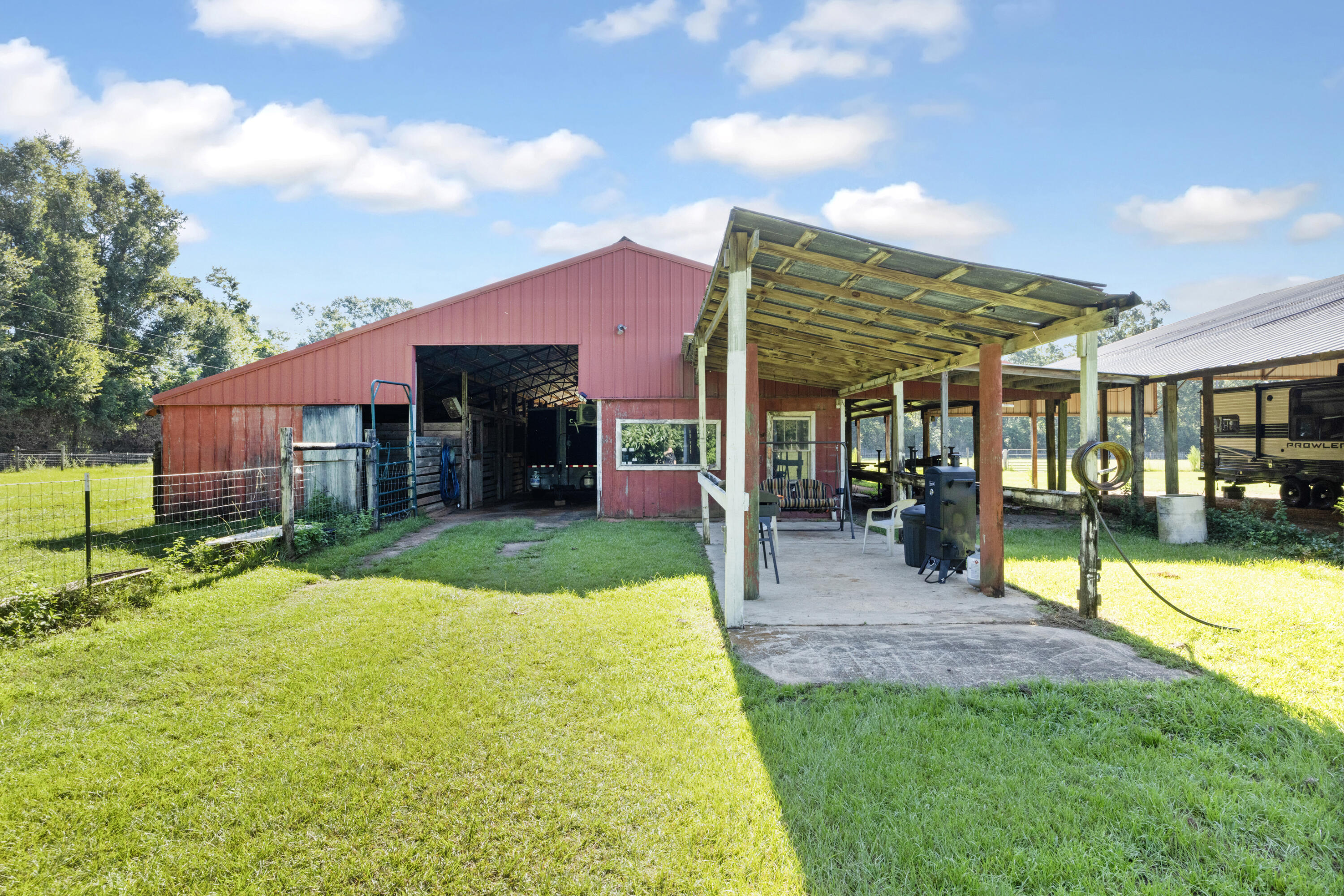 190 Peaden Bridge Road Baker, FL 32531 - Photo 39 of 73 a view of a house with a swimming pool and a yard