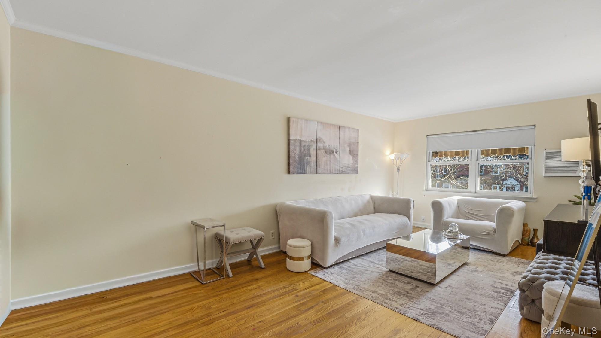 141-01 Jewel Avenue Queens, NY 11367 - Photo 15 of 21 a living room with furniture and a window