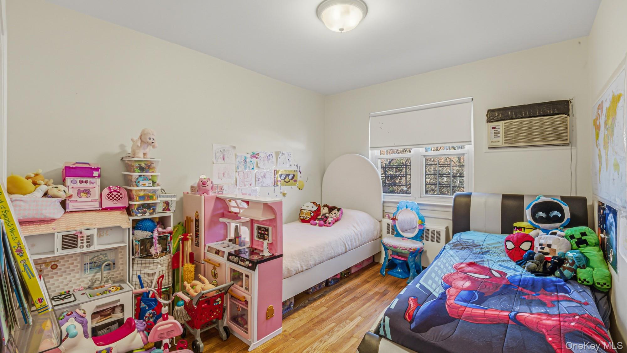 141-01 Jewel Avenue Queens, NY 11367 - Photo 20 of 21 a bedroom with bed and a window