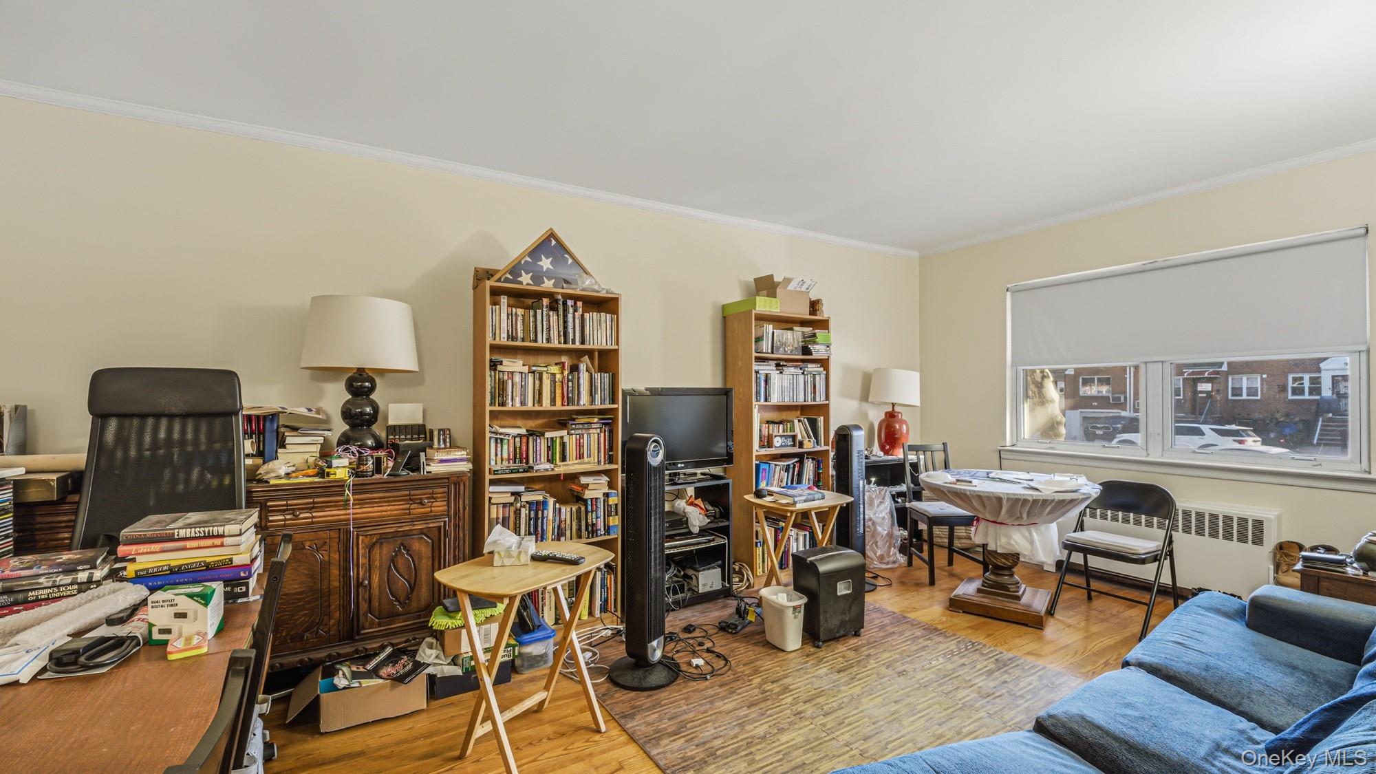 141-01 Jewel Avenue Queens, NY 11367 - Photo 6 of 21 a view of a workspace with furniture and toys