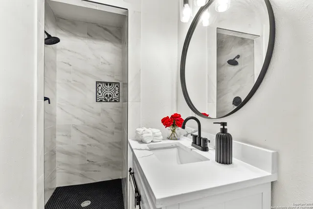 a bathroom with a sink and a mirror