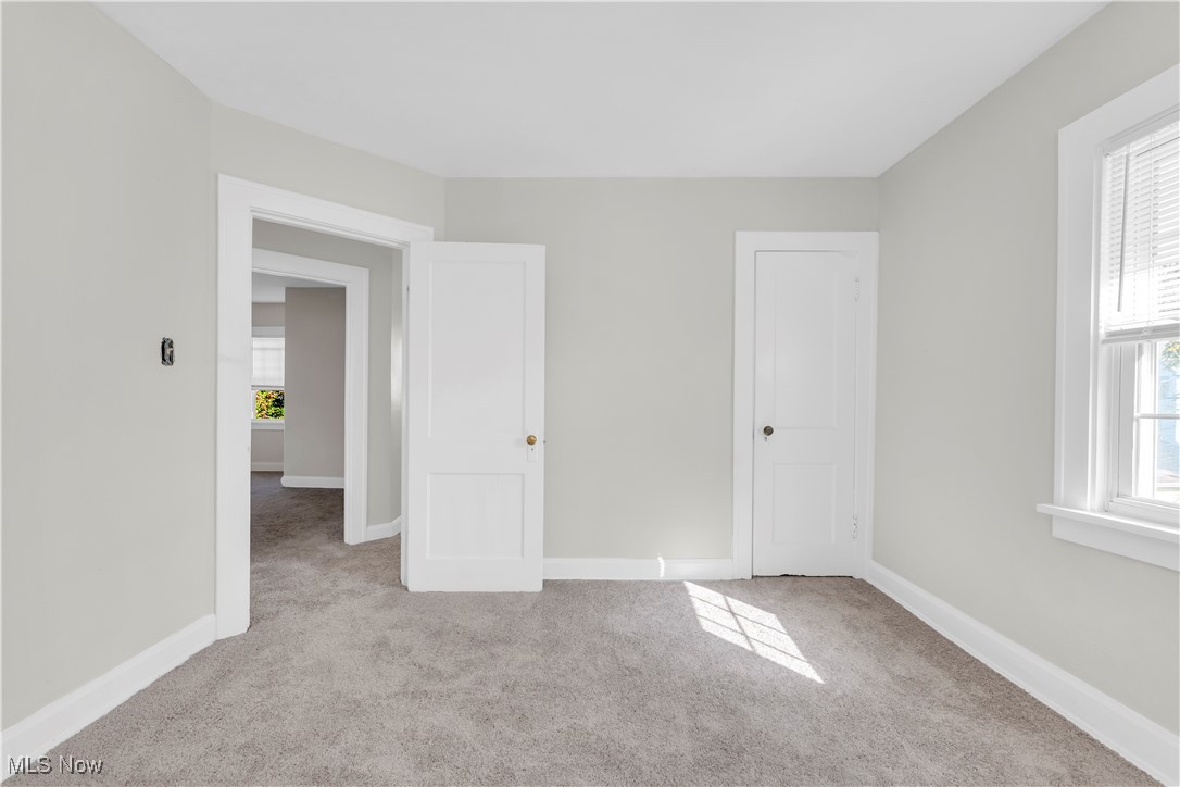 945 Nela View Road Cleveland Heights, OH 44112 - Photo 19 of 27 Unfurnished bedroom with carpet flooring and baseboards