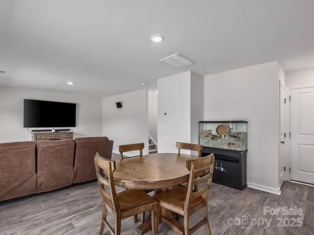 a view of a livingroom with furniture and a flat screen tv
