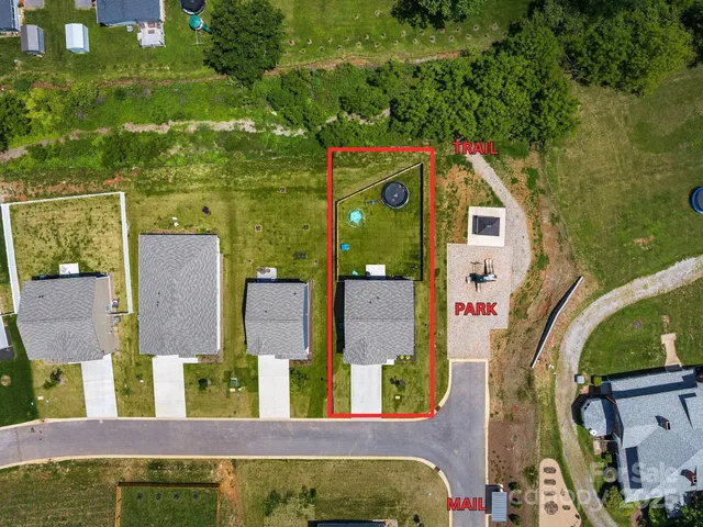 an aerial view of a house having swimming pool