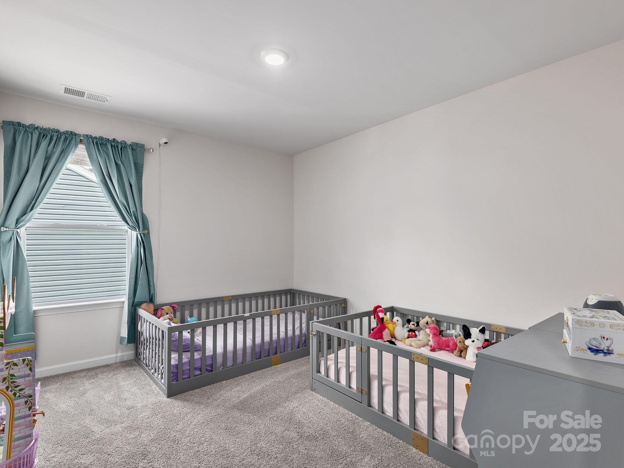 8 Madelyn Drive Clyde, NC 28721 - Photo 25 of 34 a view of a hallway to a livingroom with toys