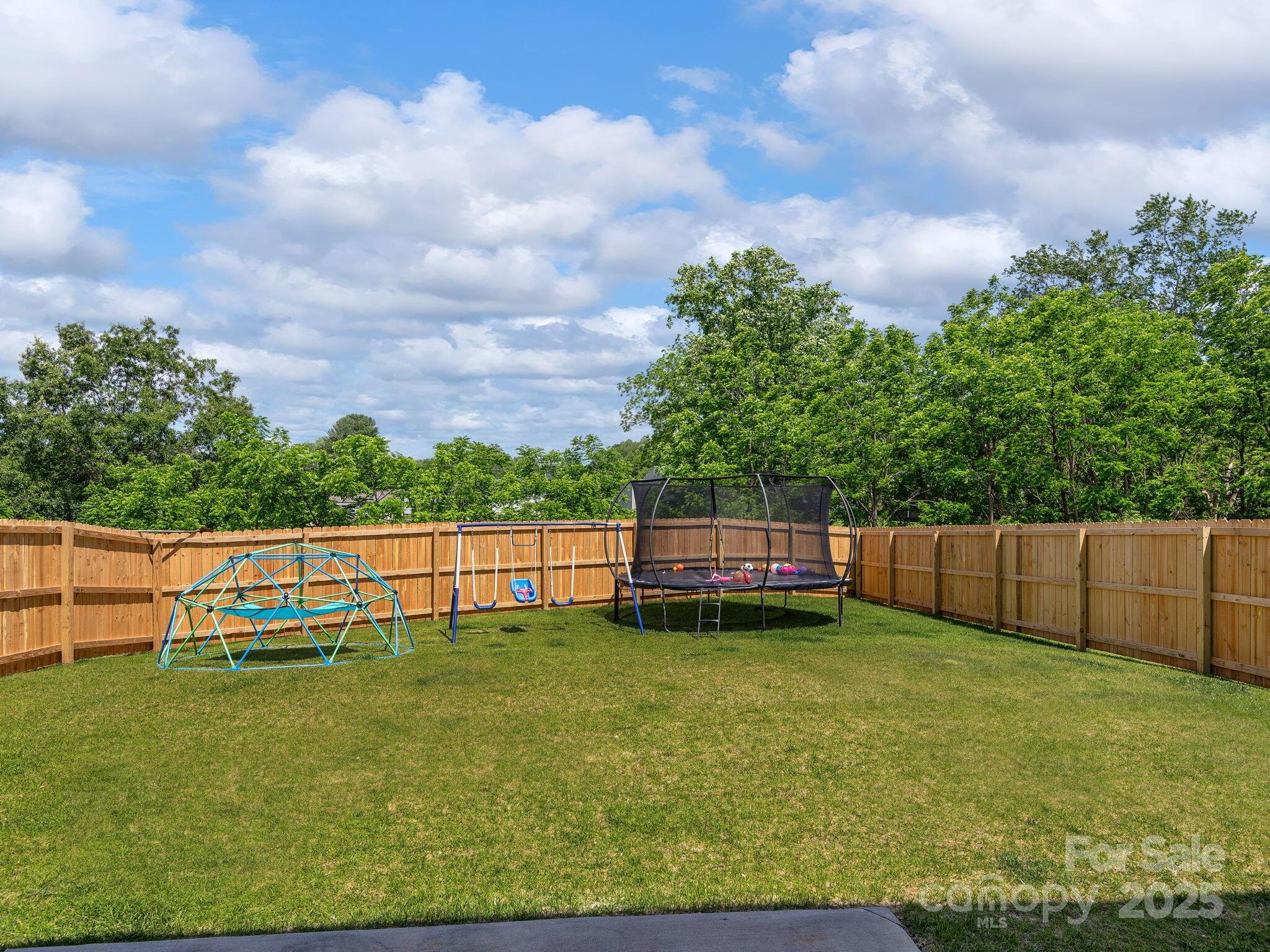 8 Madelyn Drive Clyde, NC 28721 - Photo 28 of 34 a view of a yard with large trees and a big yard