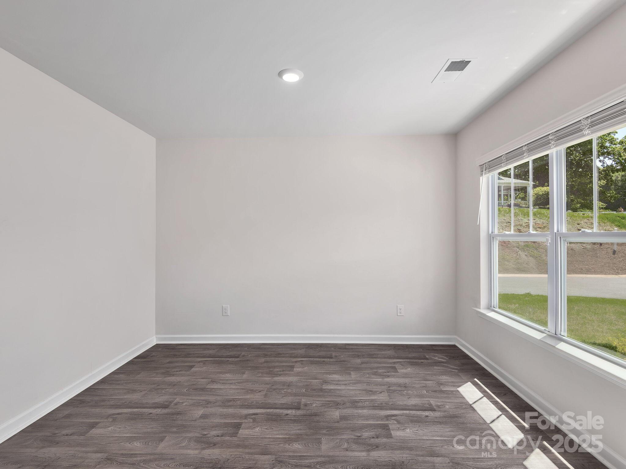 8 Madelyn Drive Clyde, NC 28721 - Photo 4 of 34 wooden floor in an empty room with a window
