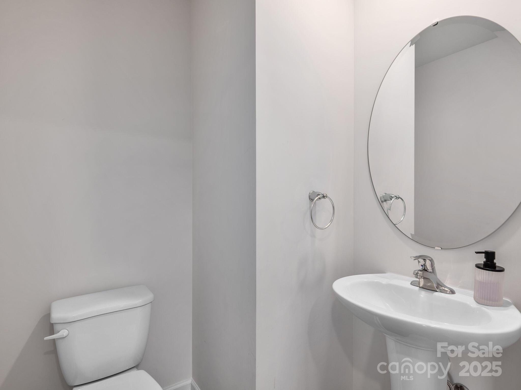 8 Madelyn Drive Clyde, NC 28721 - Photo 6 of 34 a bathroom with a sink and mirror