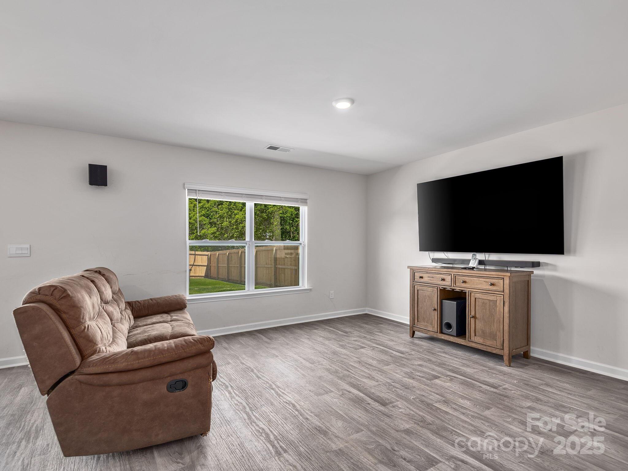 8 Madelyn Drive Clyde, NC 28721 - Photo 7 of 34 a living room with furniture and a flat screen tv