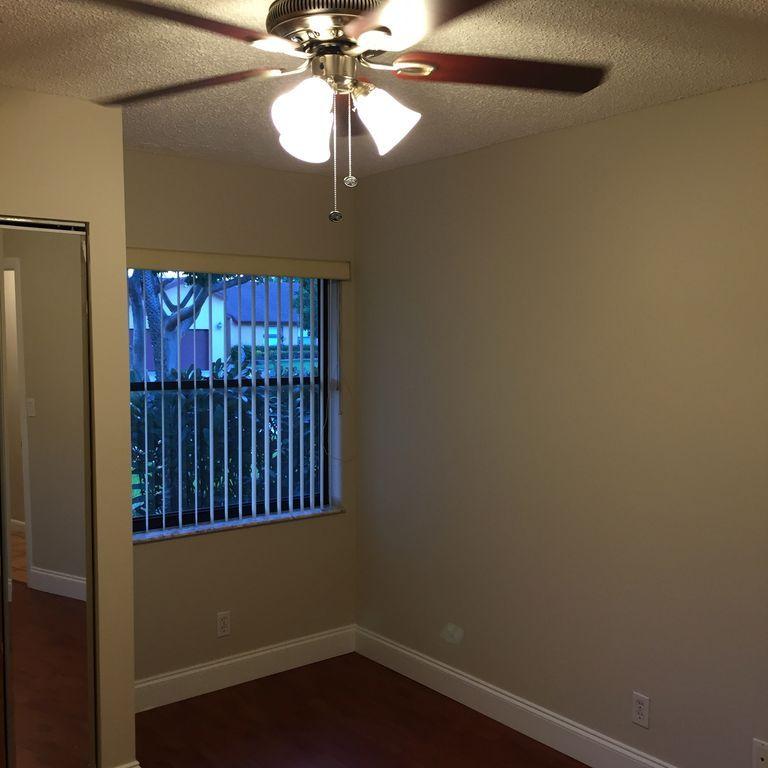 9182 Gettysburg Road Boca Raton, FL 33434 - Photo 16 of 23 a view of a small space with wooden floor fan and a window