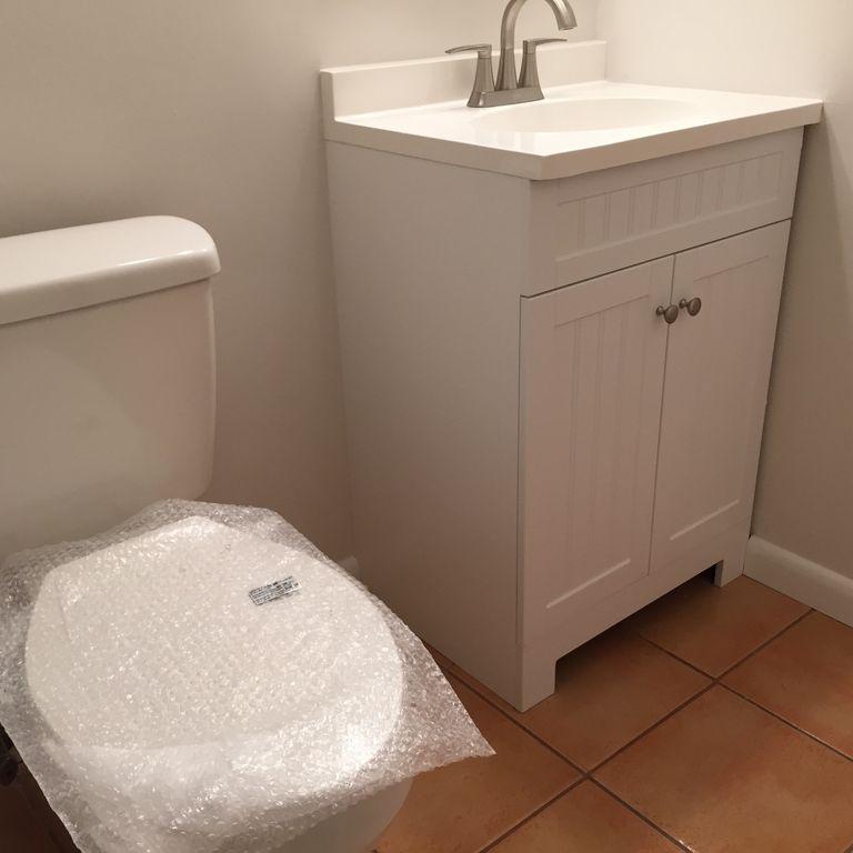9182 Gettysburg Road Boca Raton, FL 33434 - Photo 18 of 23 a bathroom with a sink and a toilet