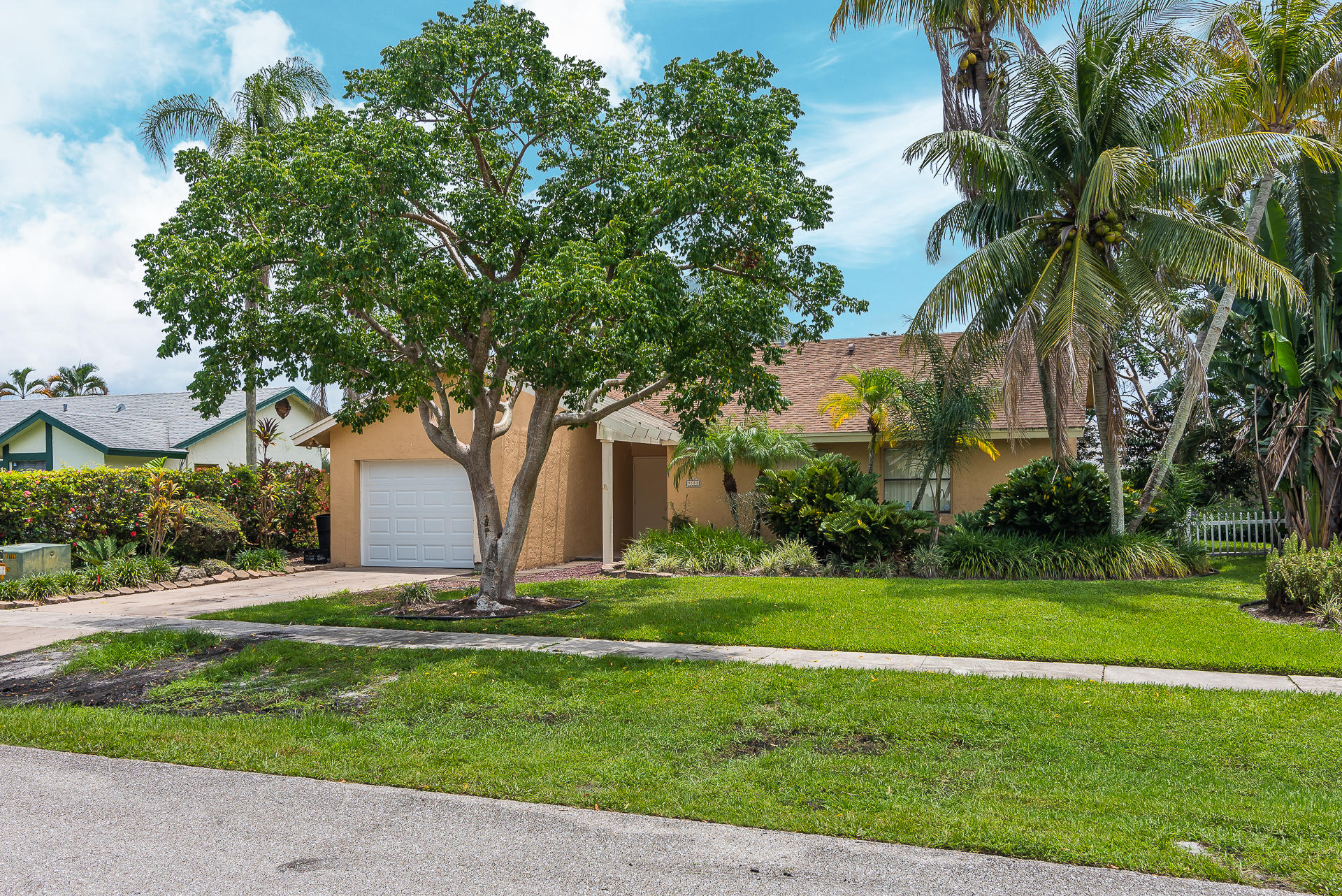 9182 Gettysburg Road Boca Raton, FL 33434 - Photo 3 of 23 a view of a house with a yard
