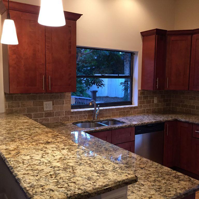 9182 Gettysburg Road Boca Raton, FL 33434 - Photo 5 of 23 a kitchen with a sink and a cabinets