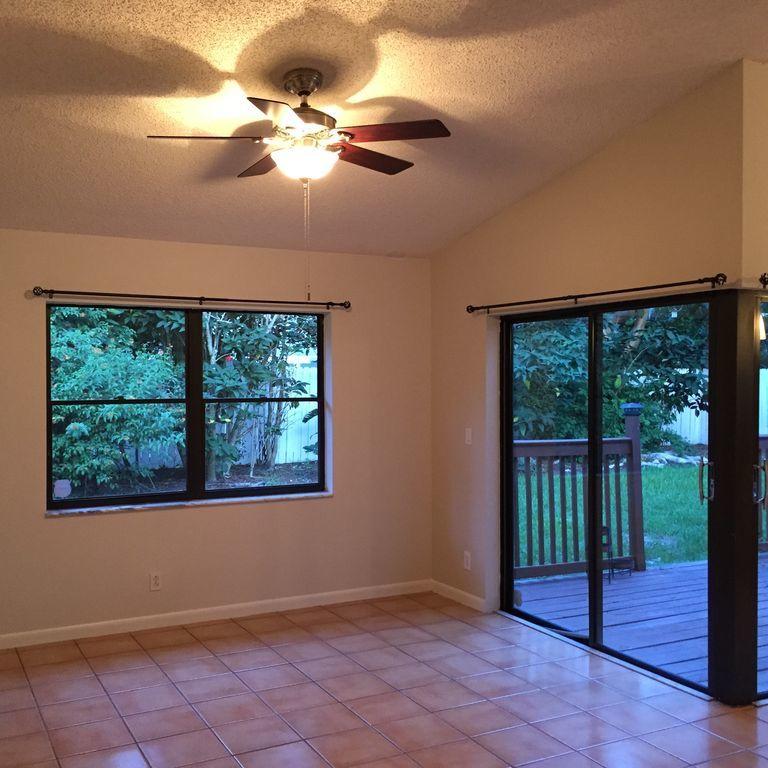 9182 Gettysburg Road Boca Raton, FL 33434 - Photo 8 of 23 a view of an empty room with a window
