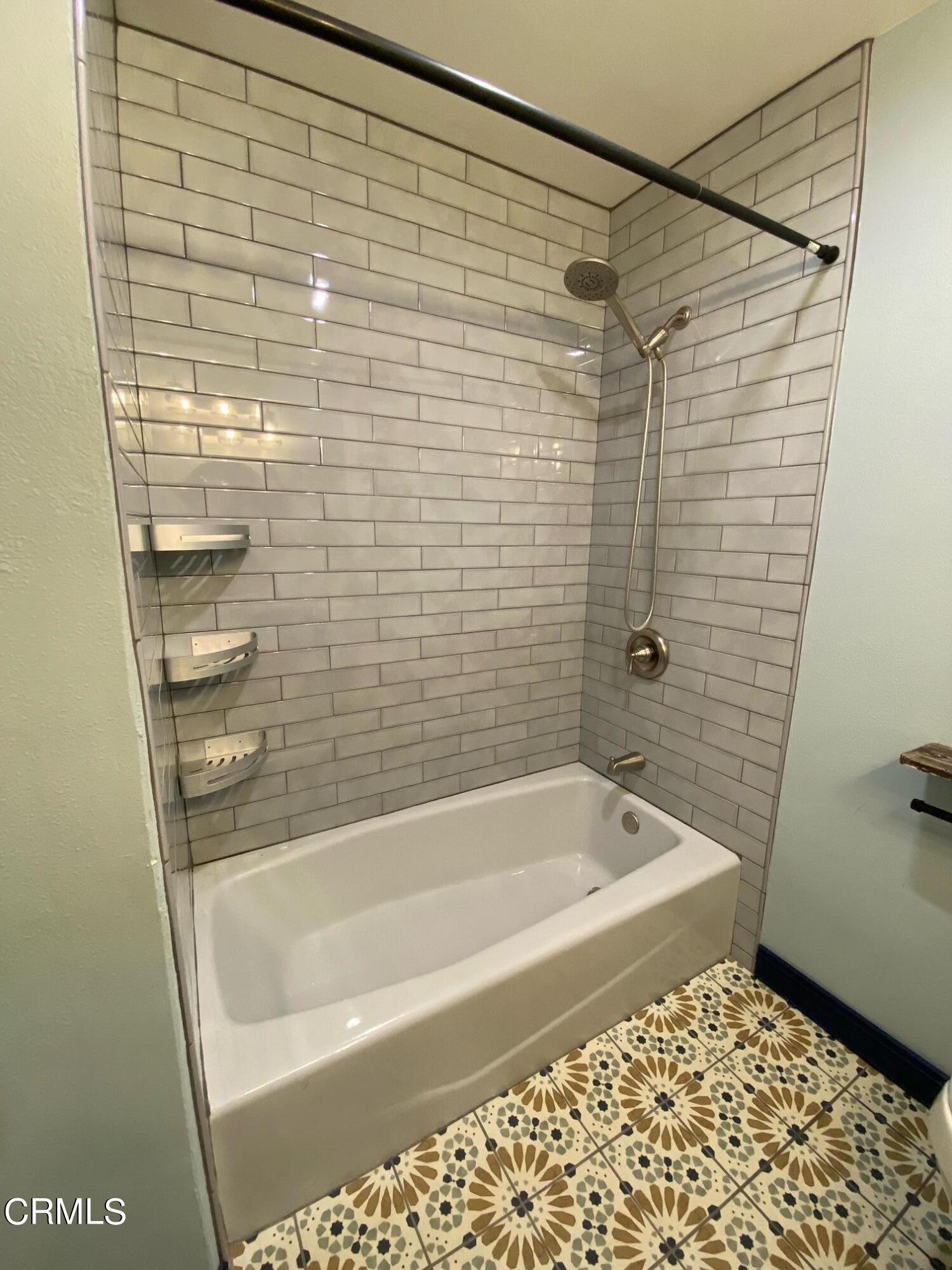 2046 Koala Way Ventura, CA 93003 - Photo 11 of 29 a bathroom with a shower and a bathtub